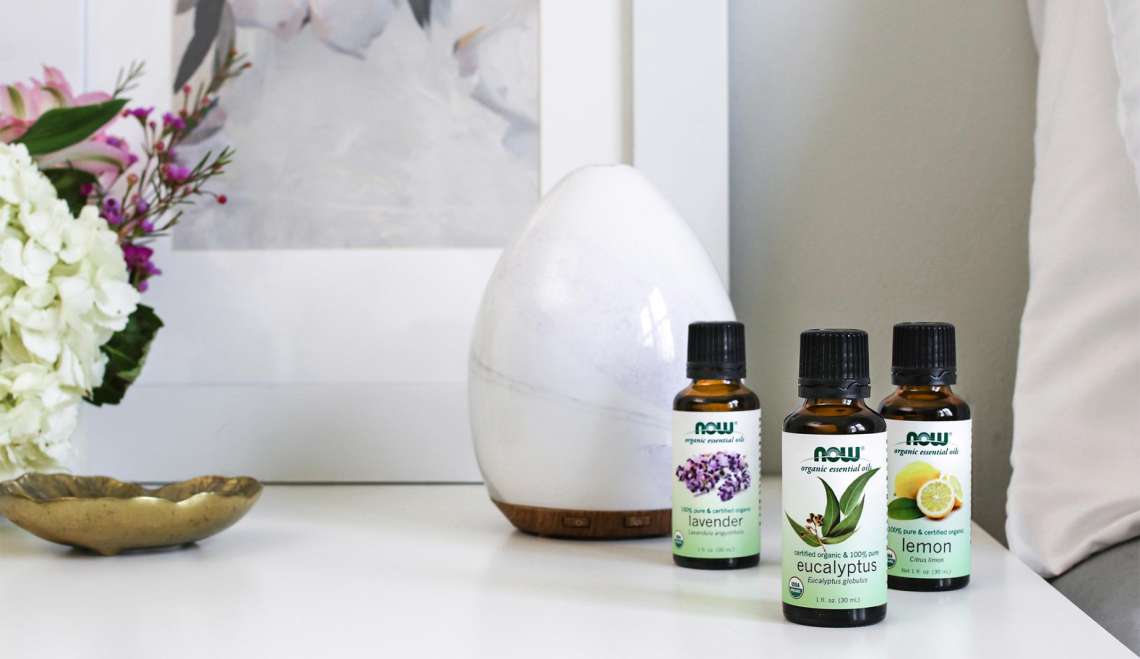 A close-up of the essential oils on the side table